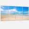 Designart - Large Clouds Over Calm Beach - Seashore Photo Canvas Print